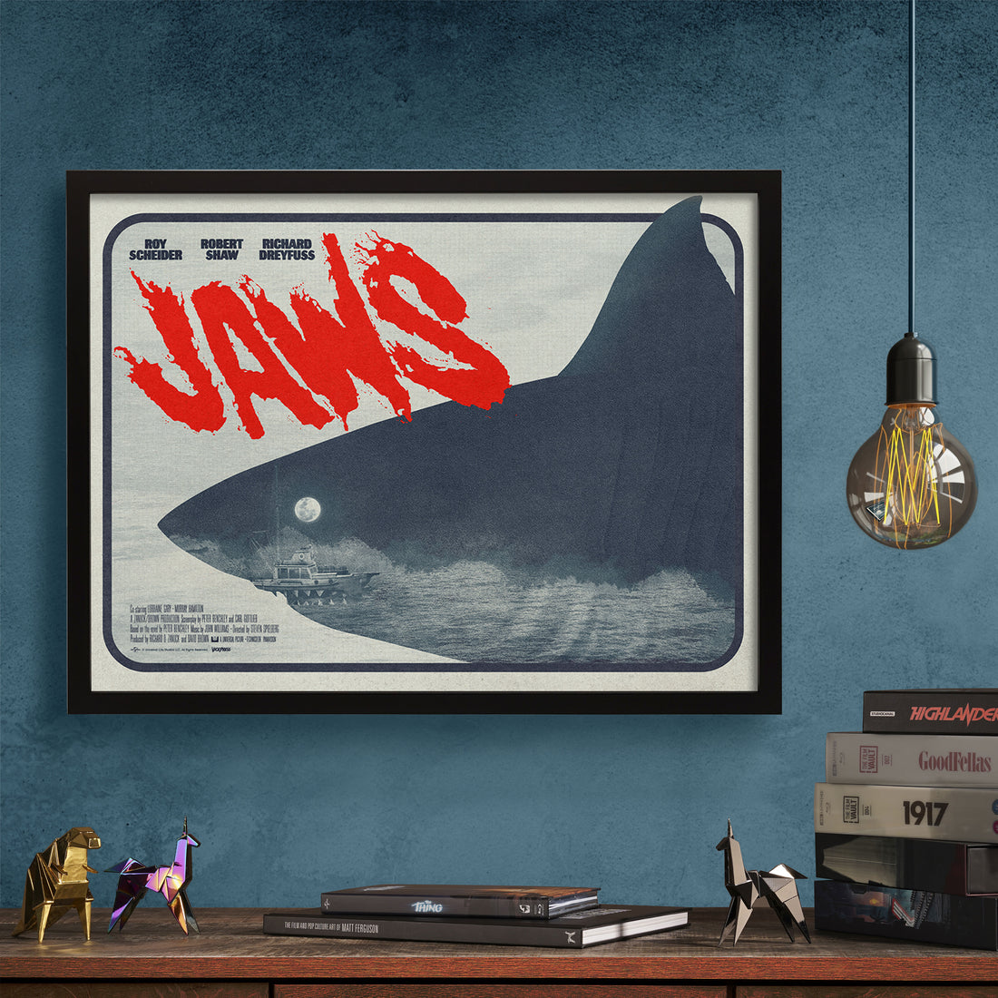 Jaws movie poster by Matt needle in black frame on a wall